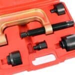 Kliješta za vođenje s odvijačem i adapternim setom u crvenoj kutiji.