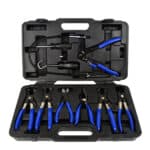 Set alata za rad na vazdušni compressor, uključujući kliješta i prirubnice za održavanje.